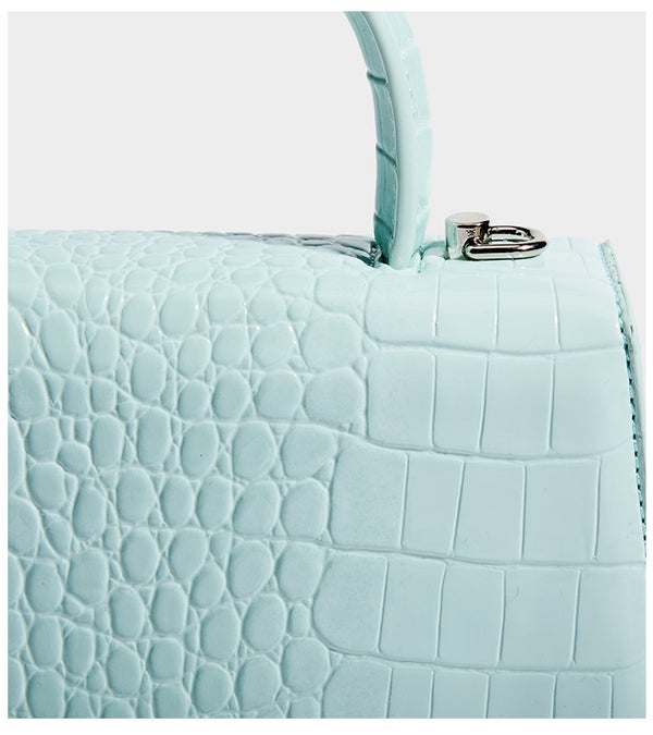 Mini croc-embossed glossy structured handbag with silver-tone turn-lock clasp and short top handle, detail view 17
