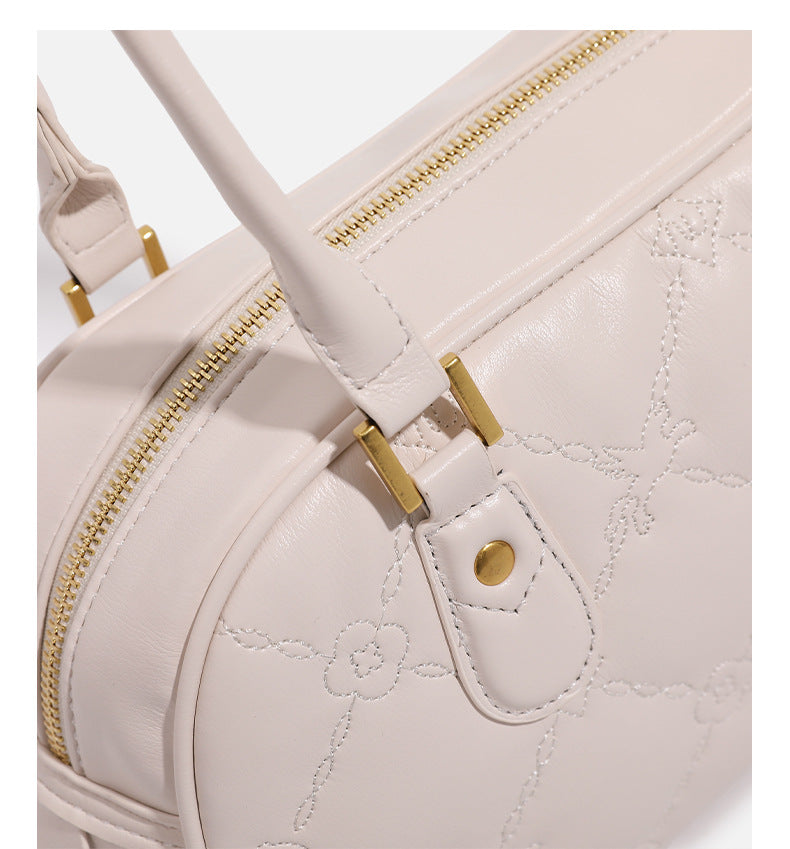 Small structured quilted leather-look zip shoulder bag with gold-tone hardware and adjustable strap, detail view 19