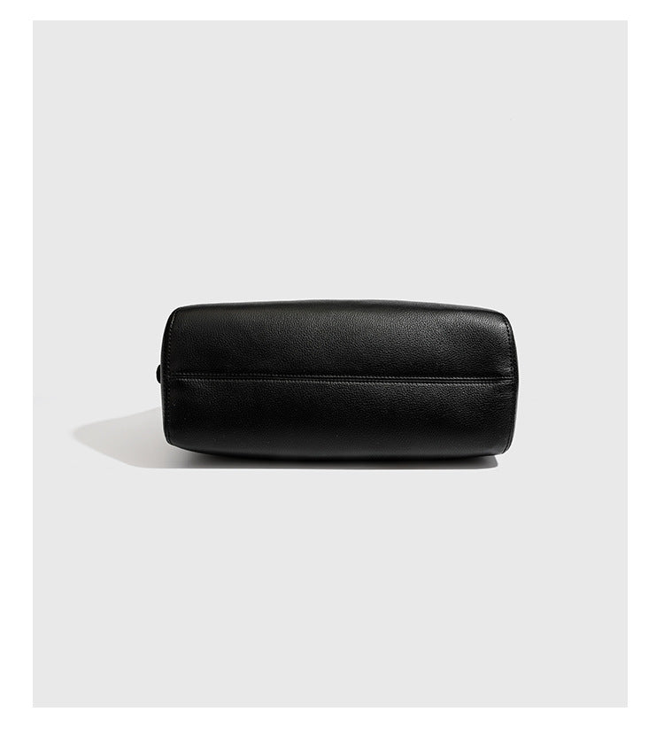 Large black pebbled leather-look hobo shoulder bag with silver-tone turn-lock front hardware and single flat adjustable