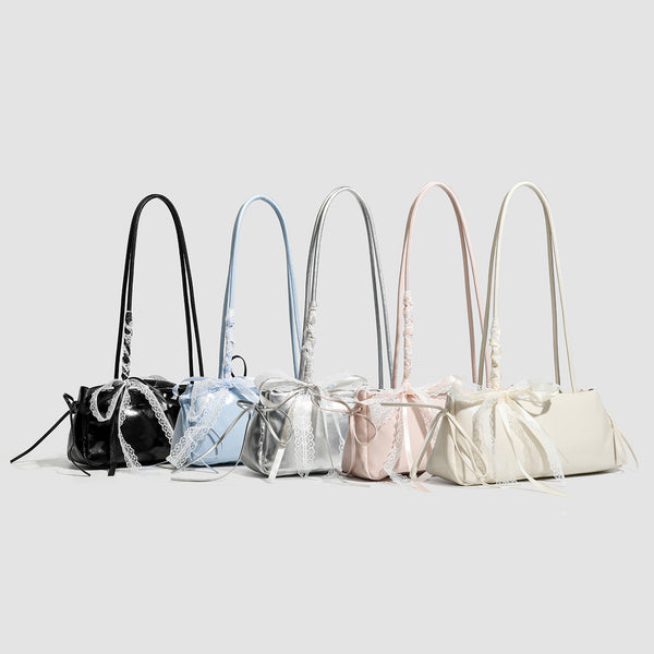Compact glossy leather-look shoulder bag with lace bow and ribbon trim, detail view 2