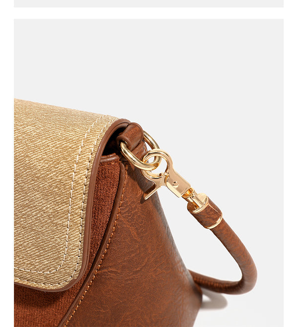 Structured trapezoid shoulder bag with pale textured flap, gold-tone triangular turn-lock closure, and long knotted cord