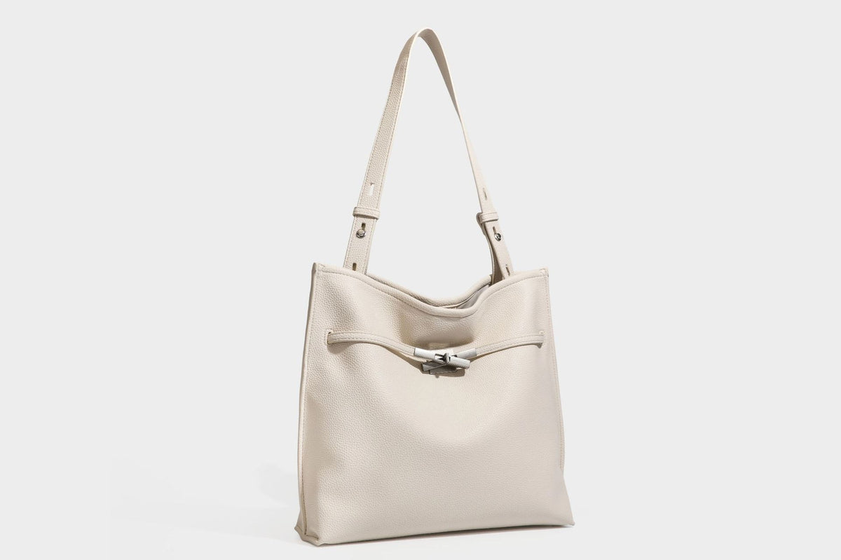 Pebbled leather-look tote bag with front toggle hardware and long shoulder strap, detail view 37