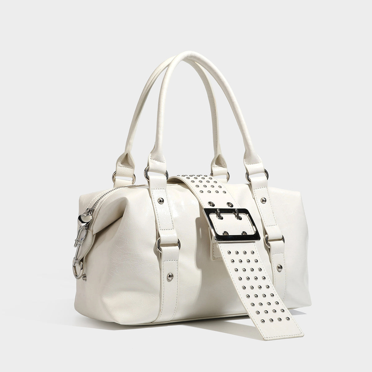 Glossy crinkled barrel handbag with silver stud buckle strap and detachable shoulder strap, detail view 3