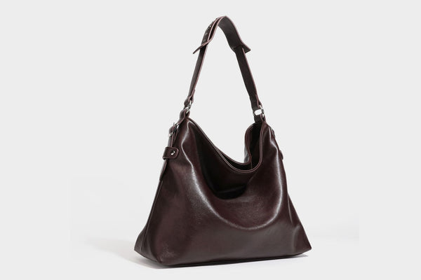 Large slouchy hobo shoulder bag in dark brown with smooth leather-look finish, adjustable strap, and silver-tone hardware