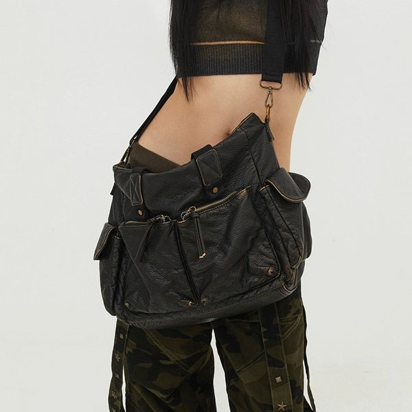 Slouchy crinkled pebbled leather-look convertible tote bag in gunmetal black with woven top handles, adjustable shoulder