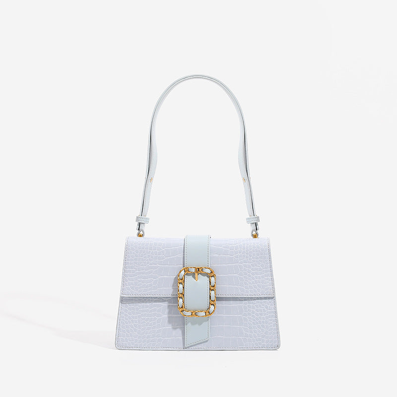 Structured crocodile-embossed flap shoulder bag with gold chain buckle hardware and adjustable strap, front view