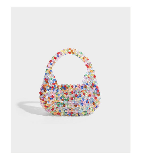 Kleine, abgerundete Hobo-Bag mit facettierten, durchscheinenden Perlen in Kristalloptik, passendem Perlenhenkel oben und silberfarbenen Details