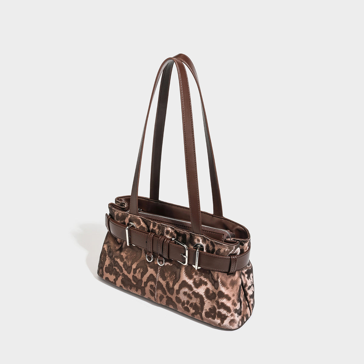 Leopard-print shoulder tote bag with brown leather-look trim, belt-buckle front detail, silver-tone hardware, and long