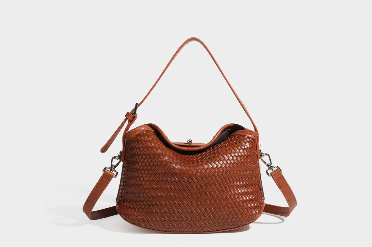 Small woven-look leather-look flap shoulder hobo bag in burgundy with silver-tone hardware and decorative tassel charm