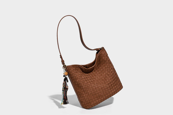 Dark chocolate woven texture hobo shoulder bag with multicolor tassel-and-bead charm and long adjustable strap, detail view