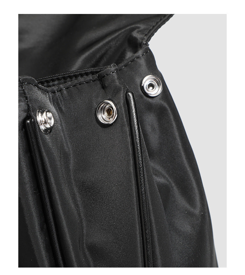 Structured black leather-look flap satchel bag with silver turn-lock hardware and top handle, detail view 31
