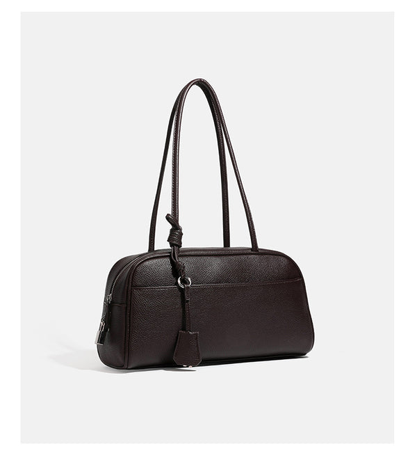 Structured rounded rectangular shoulder bag with pebbled leather-look finish, dual long handles, top zipper, front zip