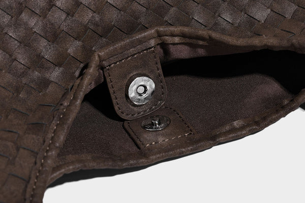 Slouchy woven hobo shoulder bag with knotted strap and matte leather-look textured finish, detail view 28