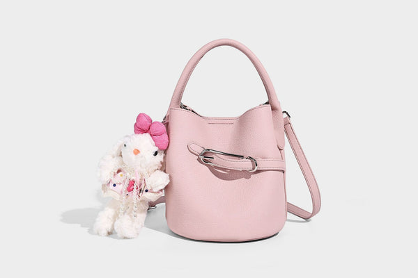 Mini pebbled leather-look bucket bag with front buckle strap, silver-tone hardware, top handle, and detachable shoulder