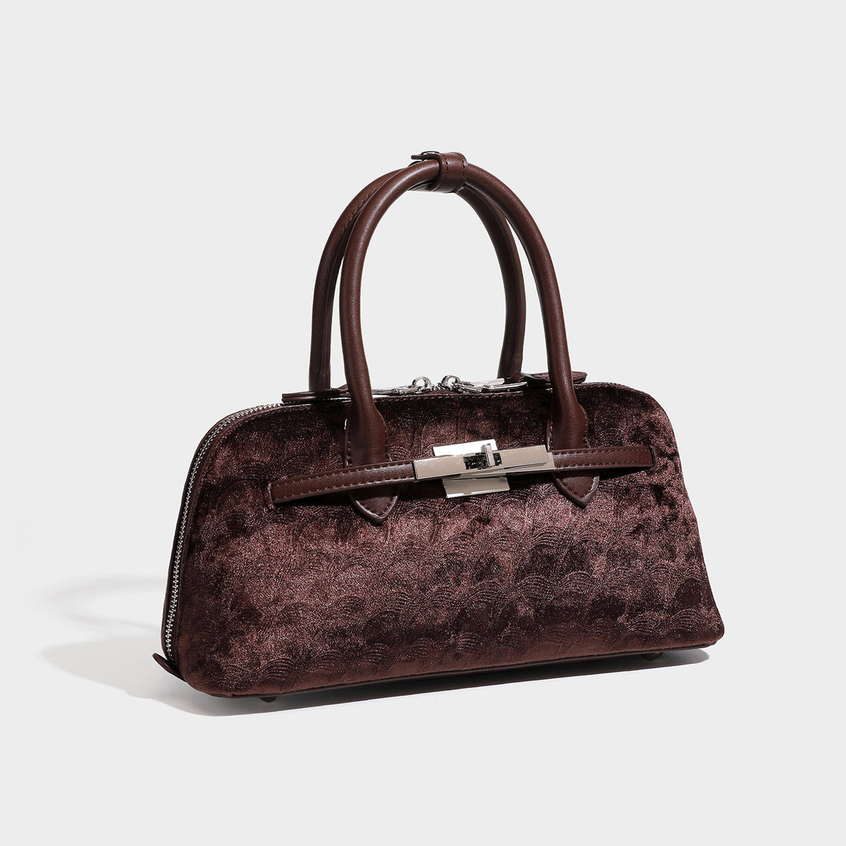 Small structured satchel bag in dark brown velvet-like textured finish with leather-look trim, silver-tone turn-lock bar