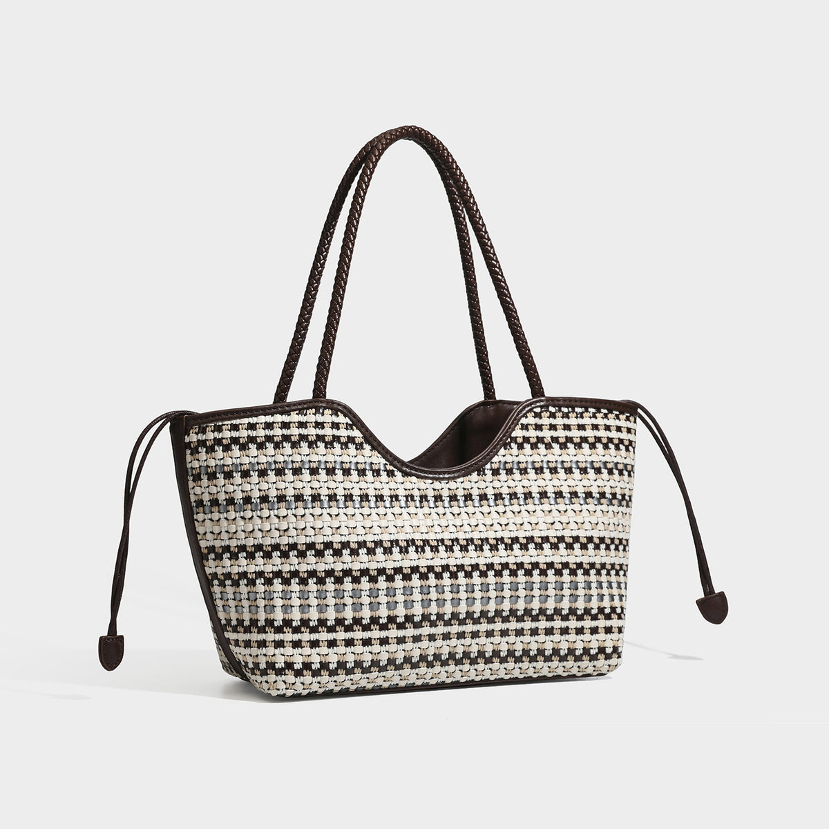 Large woven checker-pattern tote bag with dark braided shoulder straps, leather-look trim, and drawstring side ties, front