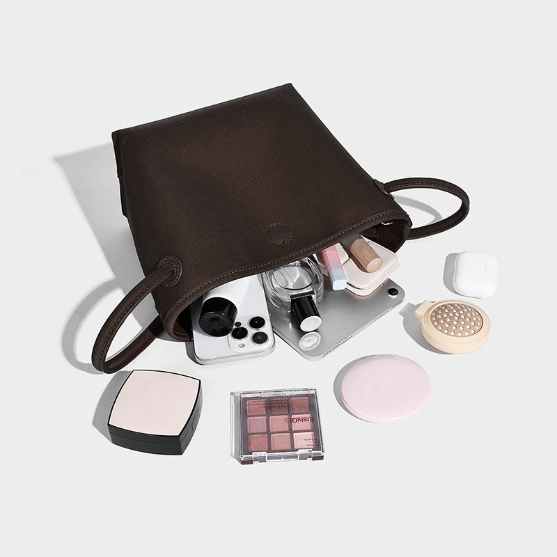 Small structured matte pebbled tote bag with twin top handles and removable zip pouch, detail view 4