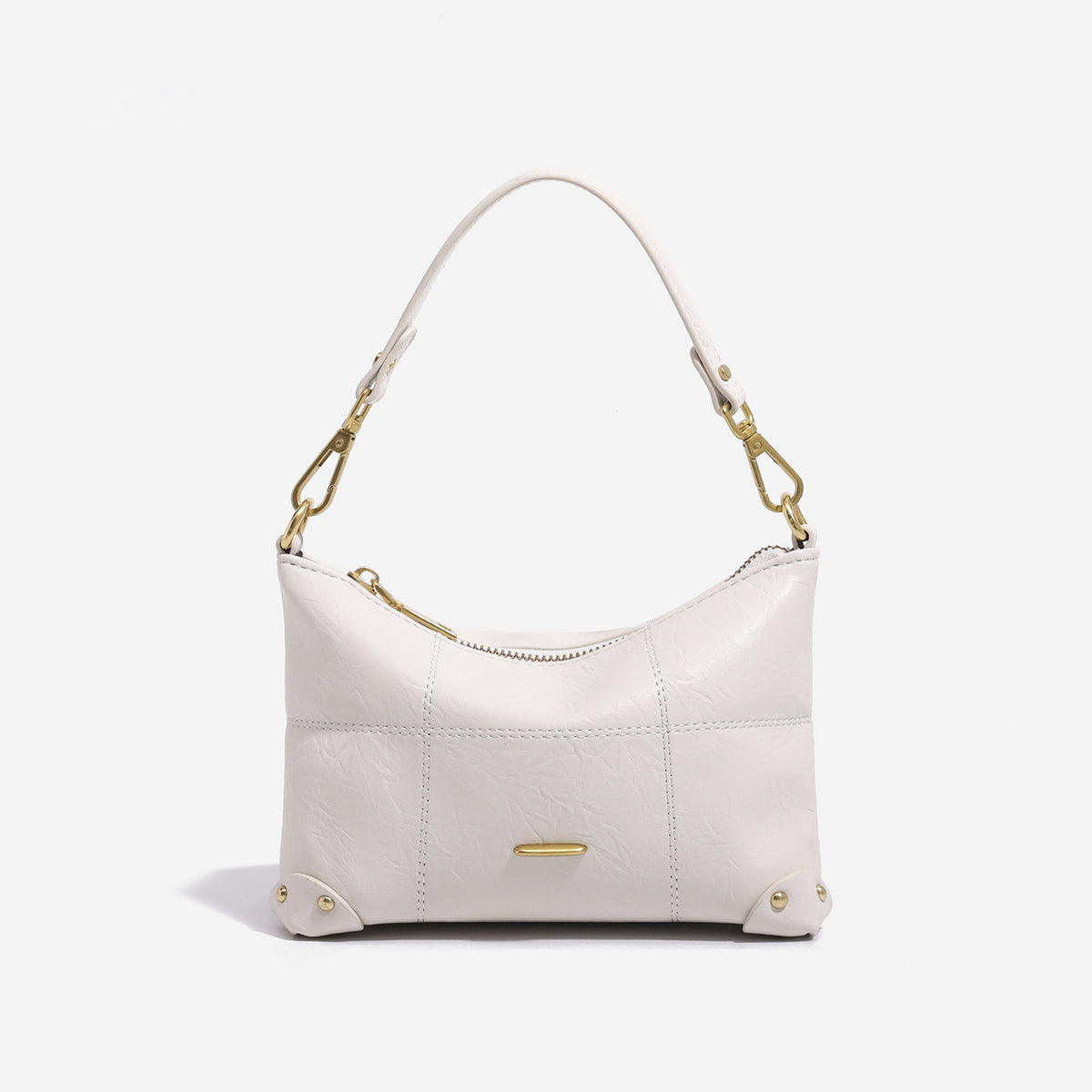 Small soft-structured shoulder bag with curved zip closure, stitched panel detailing, and gold-tone hardware, detail view 6