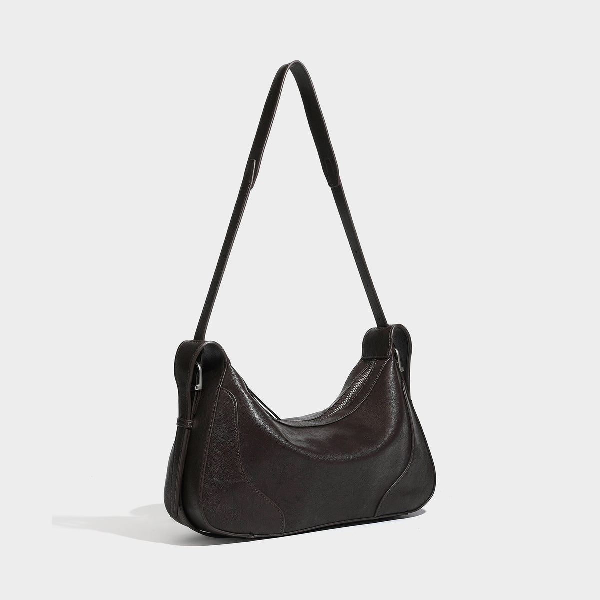 Slouchy crescent hobo shoulder bag in dark brown pebbled leather-look finish with zip top and long shoulder strap, detail