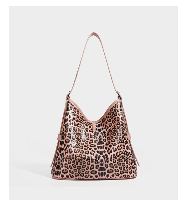 Slouchy leopard print shoulder hobo bag with black leather-look trim, tie-top closure, and single long strap, detail view 15