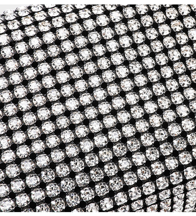 Small rectangular all-over rhinestone crossbody bag with pearl bead zipper pull and detachable silver chain strap, detail