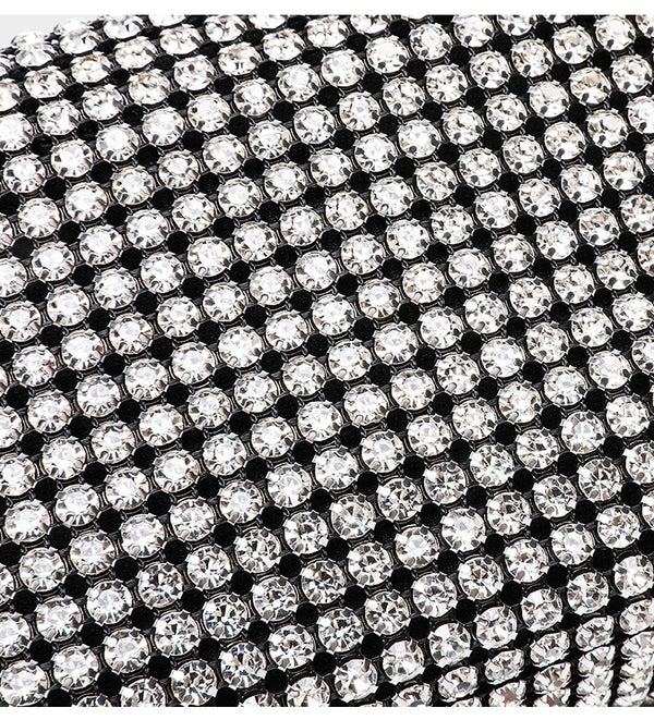 Small rectangular all-over rhinestone crossbody bag with pearl bead zipper pull and detachable silver chain strap, detail