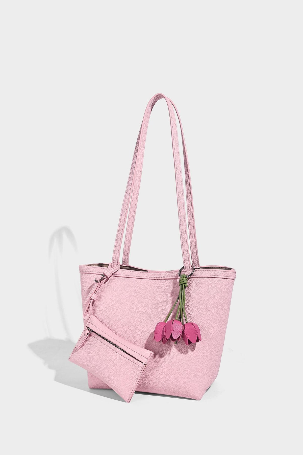 Structured pebbled leather-look tote bag in taupe with long shoulder strap, detachable zip pouch, and pink tulip flower
