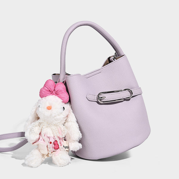 Mini pebbled leather-look bucket bag with front buckle strap, silver-tone hardware, top handle, and detachable shoulder