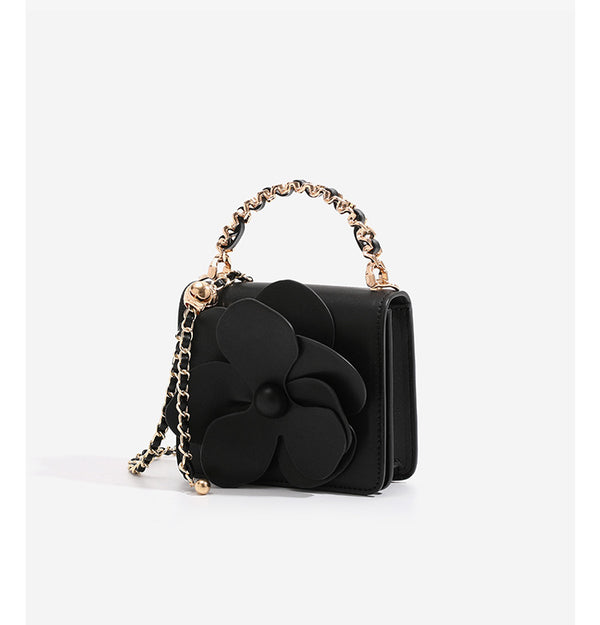 Small structured rectangular crossbody bag with layered 3D flower appliqué and gold-tone chain strap, detail view 12