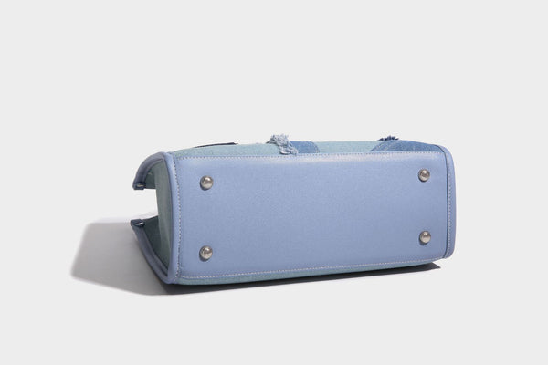 Structured patchwork denim tote bag with frayed panel seams, dual top handles, and silver-tone hardware, detail view 20