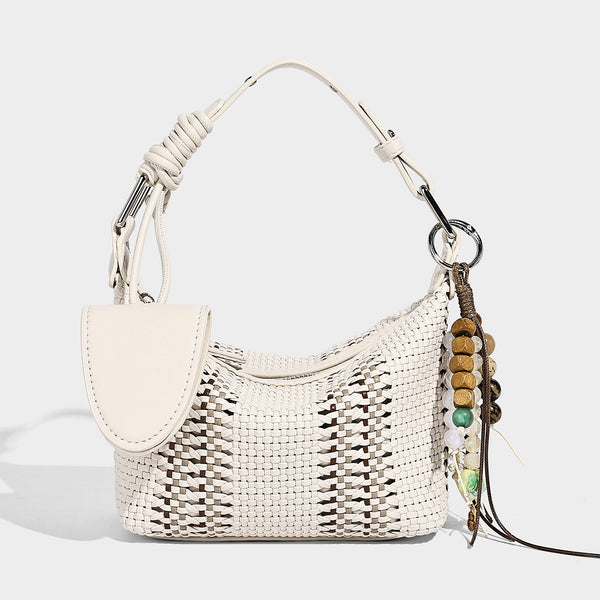 Small woven crescent shoulder bag with leather-look trim, zip closure, silver-tone ring hardware, and beaded tassel charm