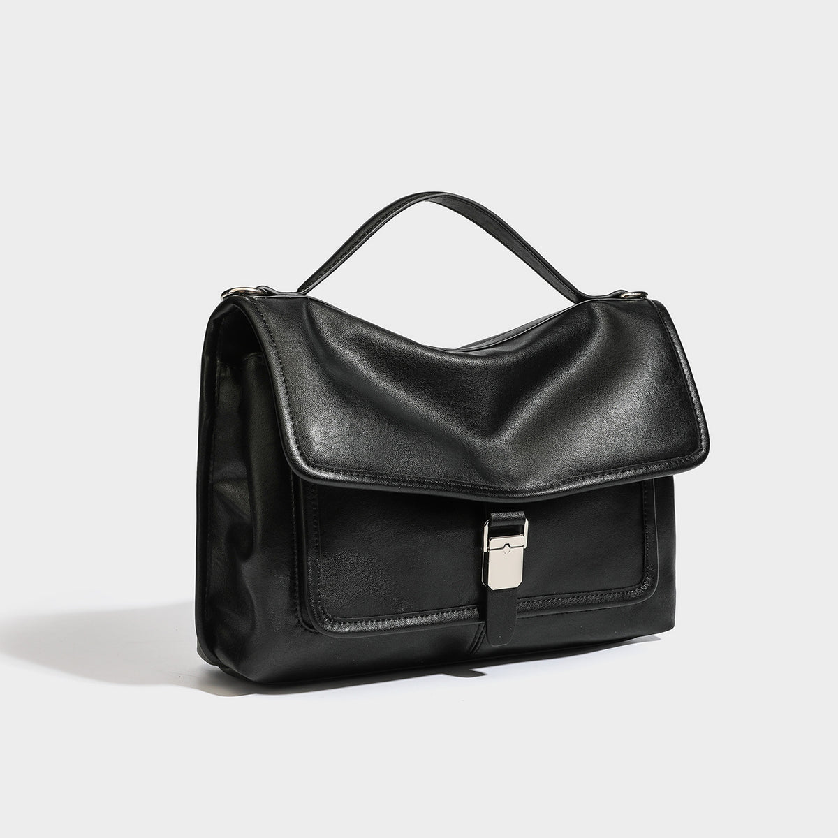 Structured rectangular flap satchel in espresso brown leather-look finish with silver-tone turn-lock buckle, top handle, and