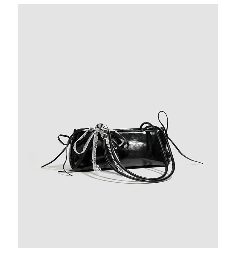 Compact glossy leather-look shoulder bag with lace bow and ribbon trim, detail view 12