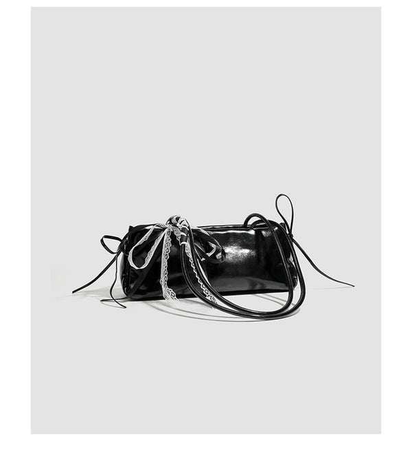 Compact glossy leather-look shoulder bag with lace bow and ribbon trim, detail view 12