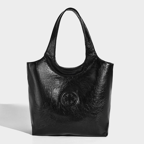 Glossy oil-wax leather-look open-top tote shoulder bag with embossed circular logo and long double straps, detail view 6