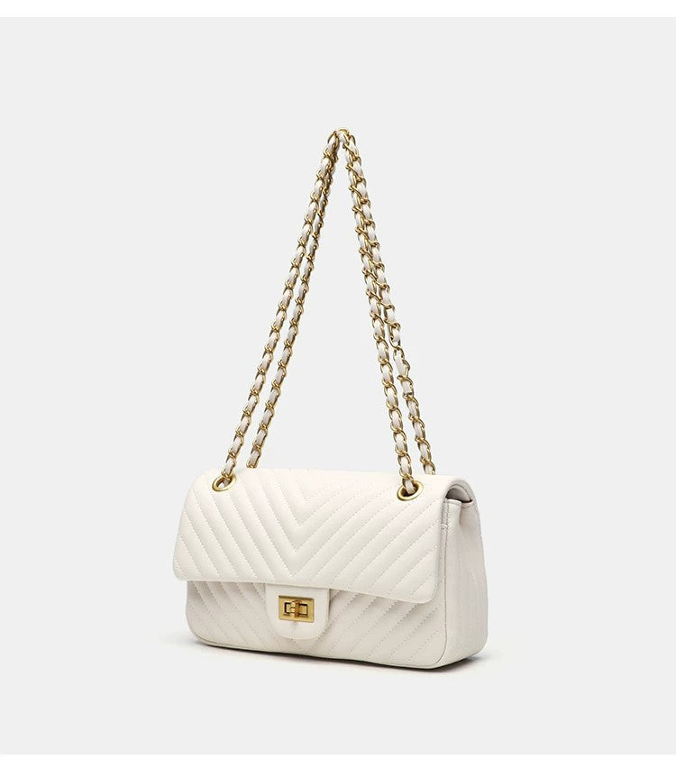 Structured quilted flap bag with gold-tone chain strap and turn-lock closure, detail view 14