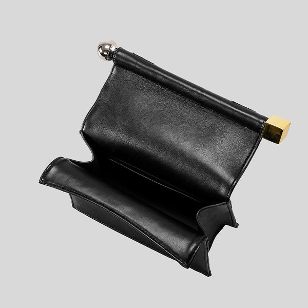 Structured rectangular clutch bag with rolled-top bar closure, gold-tone and silver-tone mixed metal hardware, detail view 3