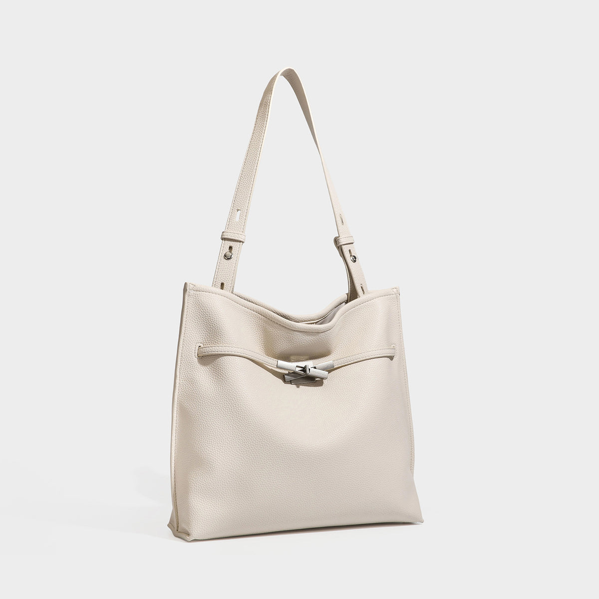 Large structured tote bag in pebbled leather-look finish with silver-tone twist-knot front detail and adjustable shoulder