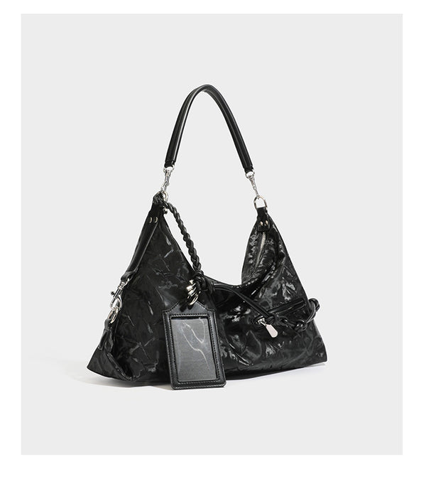 Slouchy hobo shoulder bag in crinkled metallic brown leather-look finish with braided rope knots, silver-tone hardware