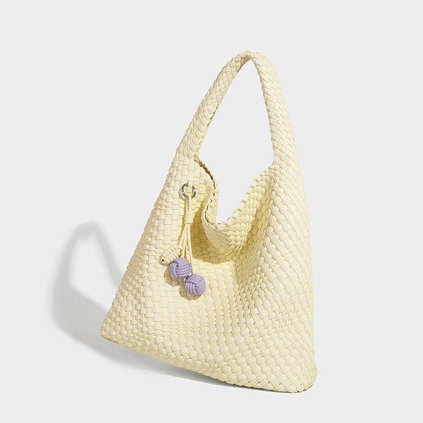 Soft hand-woven slouchy hobo tote bag with knotted tassel charm and single looped shoulder strap, detail view 30
