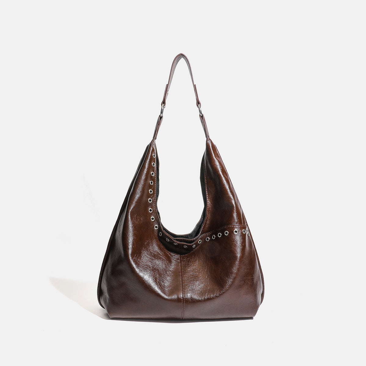 Large slouchy hobo shoulder bag with silver eyelet trim and glossy leather-look finish, detail view 7