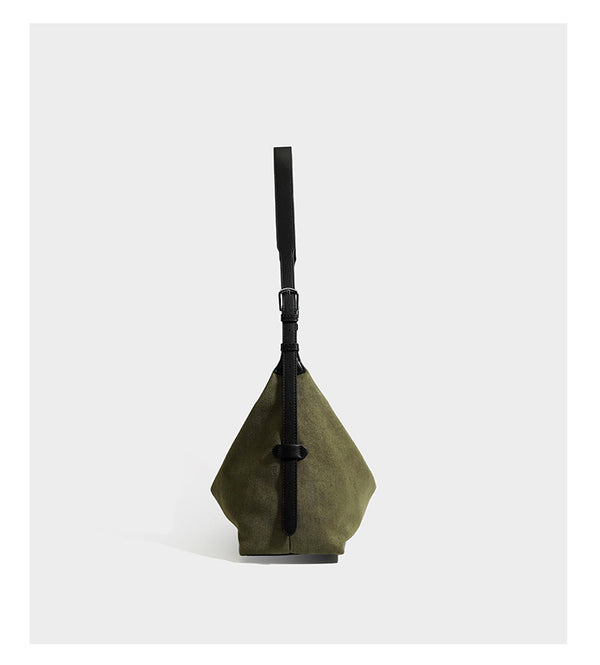Slouchy olive green canvas hobo shoulder bag with black leather-look trim, zip-top closure, and adjustable strap, detail view