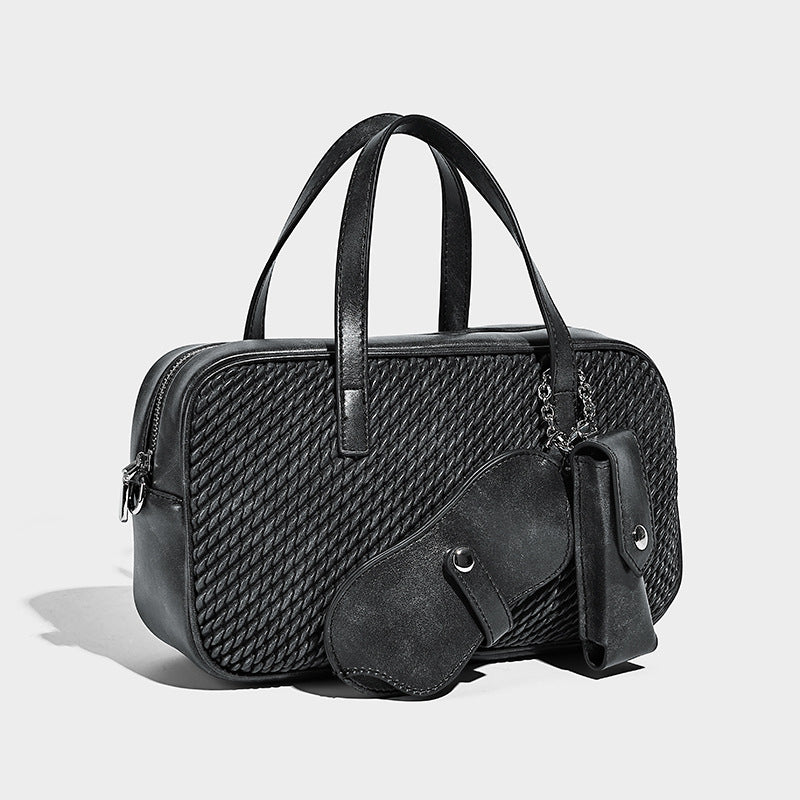 Structured woven-texture front top-handle handbag with zip closure, dual handles, detachable shoulder strap, and matching