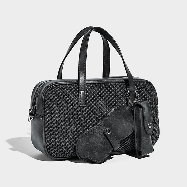 Structured woven-texture front top-handle handbag with zip closure, dual handles, detachable shoulder strap, and matching