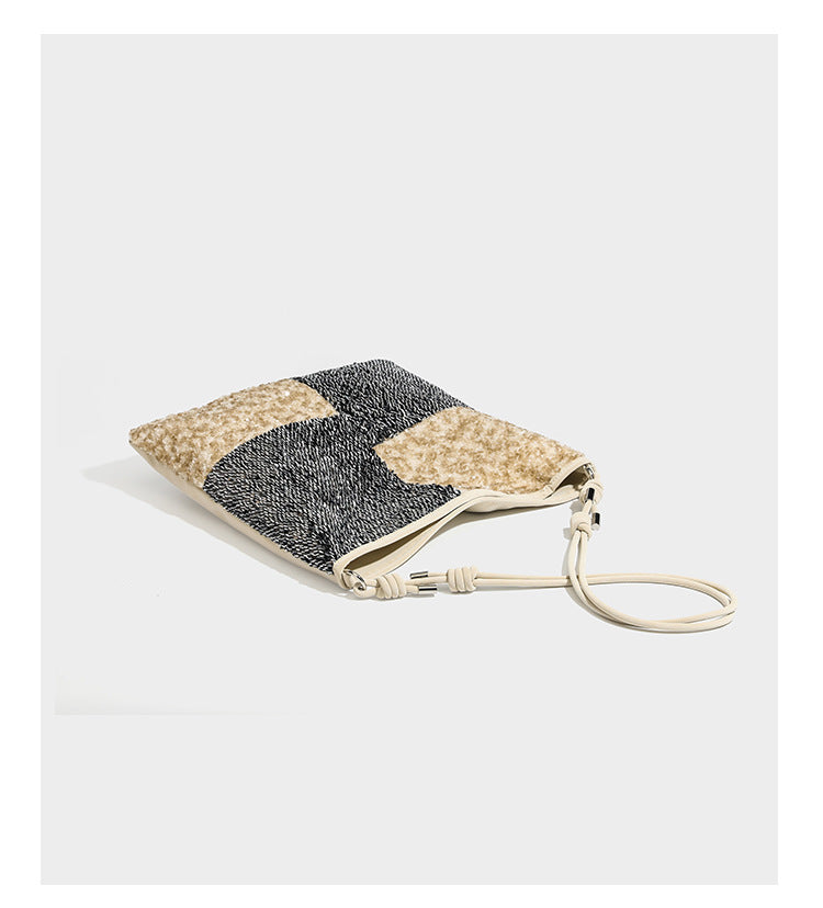 Slouchy hobo shoulder bag with black bugle-bead sequin and cream bouclé patchwork panels, adjustable cream leather-look