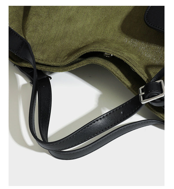 Lässig weich fallende olivgrüne Tote-Bag in Canvas-Optik mit Henkeln aus schwarzer Lederoptik, abnehmbarem Reißverschlusstäschchen und Beschlägen in Silberoptik