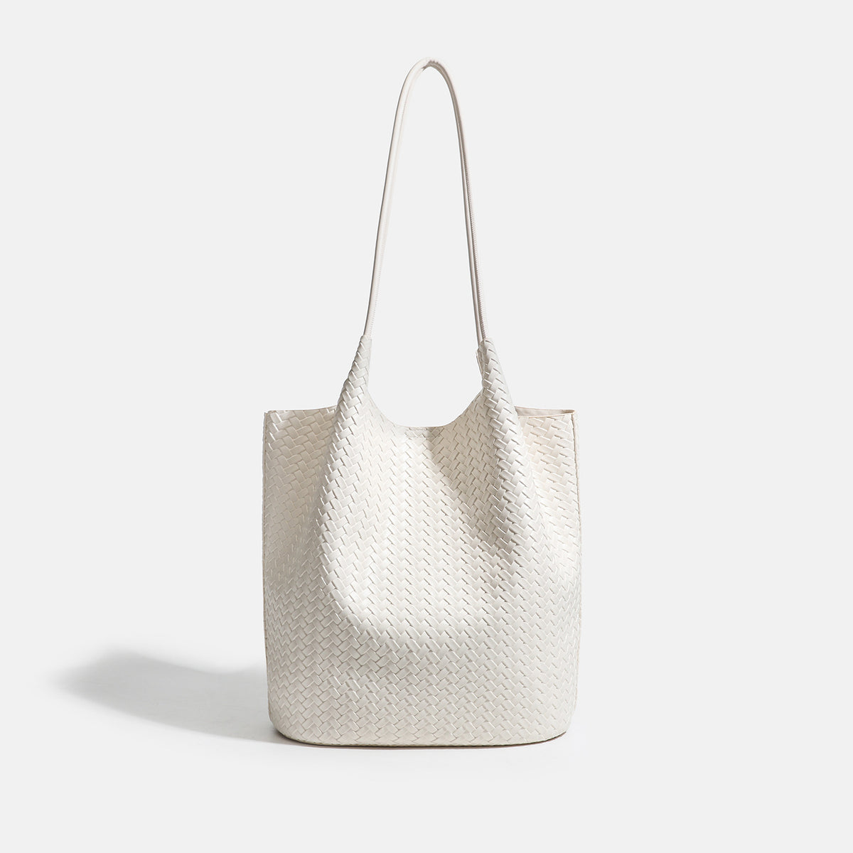 Large woven textured tote bag with long shoulder straps and structured rectangular base, detail view 7