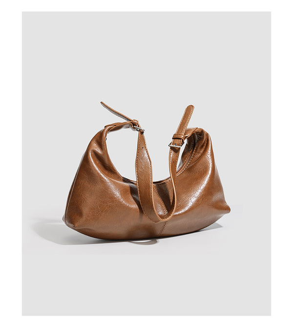 Slouchy crescent hobo shoulder bag with zip-top closure and adjustable strap, detail view 13