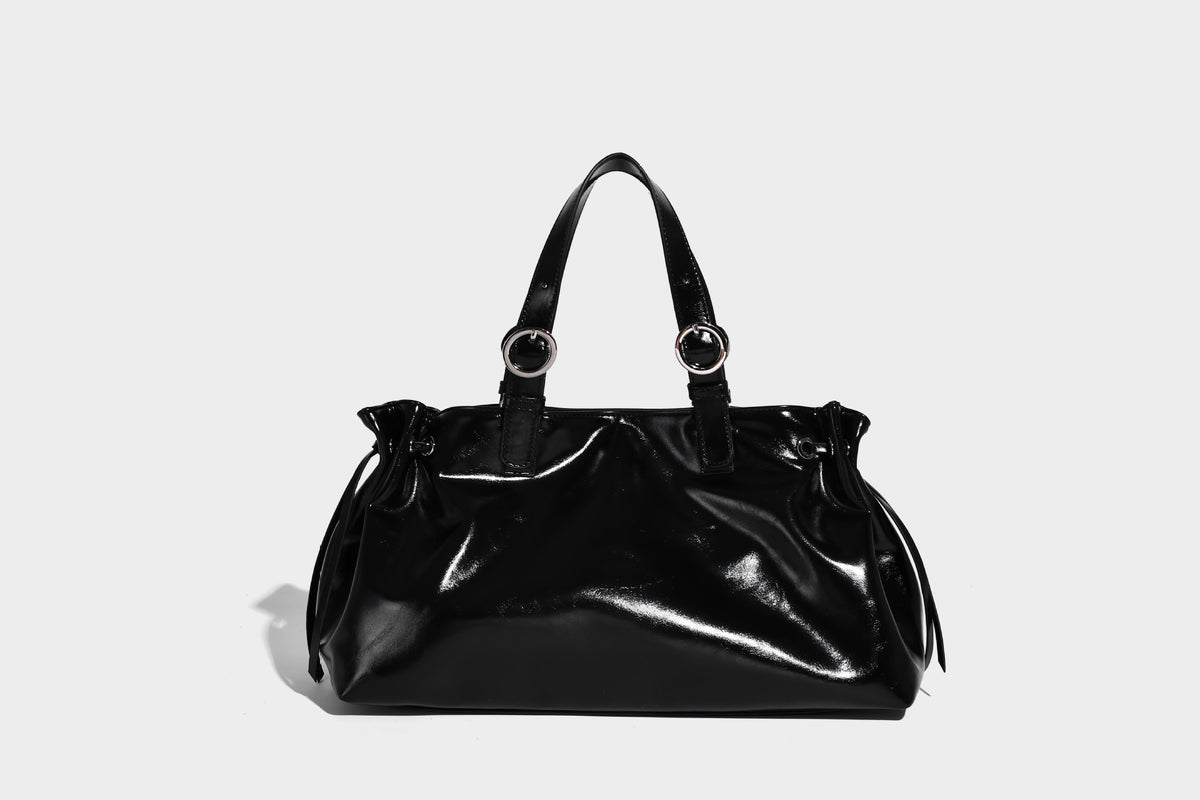 Glossy patent-look slouchy tote bag with ruched drawstring sides, dual top handles, silver ring hardware, and detachable