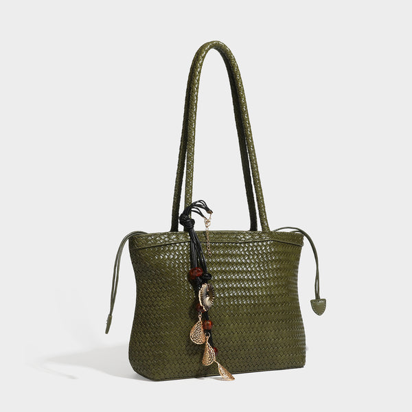 Structured woven leather-look tote bag in dark brown with long shoulder straps, side drawstring ties, and gold filigree